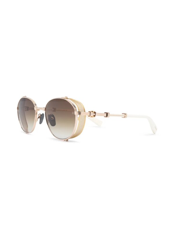 Balmain Eyewear x Akoni zonnebril met rond montuur - Goud