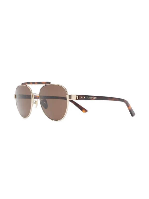 Calvin Klein CK19306 zonnebril met rond montuur - Bruin