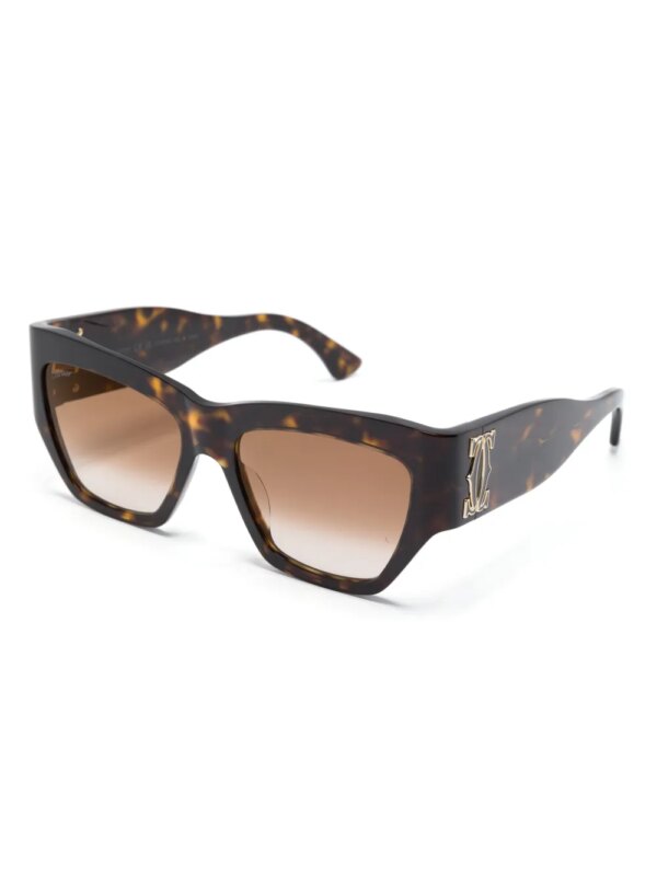 Cartier Eyewear Zonnebril met cat-eye montuur en logo-reliëf - Bruin