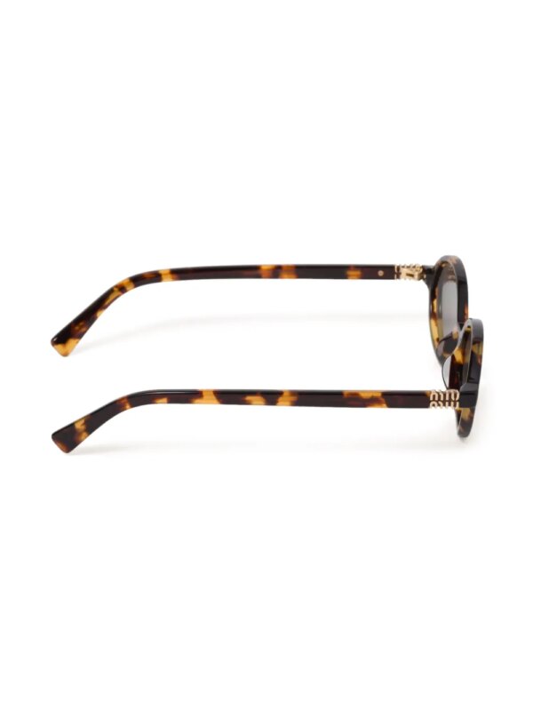Miu Miu Eyewear Regard zonnebril met ovaal montuur - Grijs