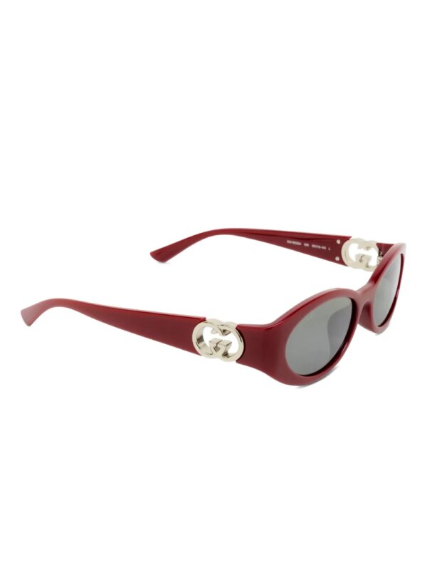 Gucci Eyewear Zonnebril met ovalen montuur en GG-logo - Rood