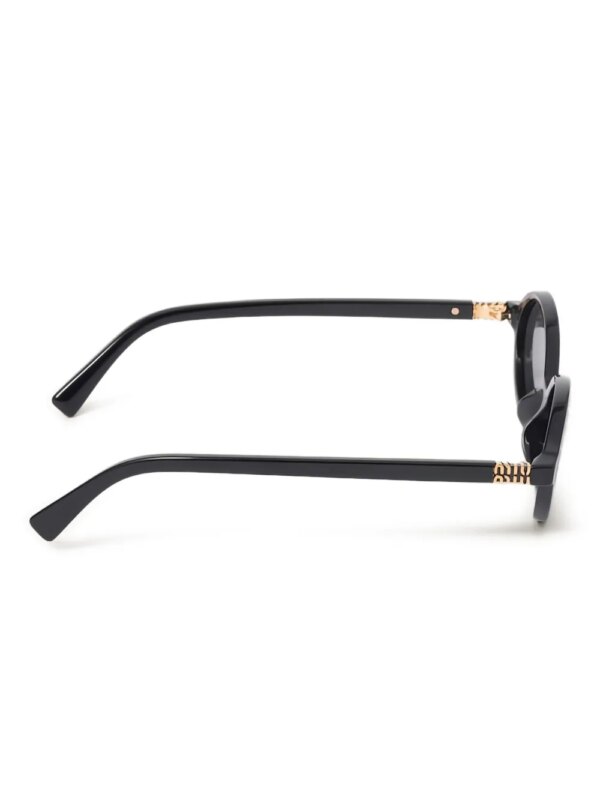 Miu Miu Eyewear Regard zonnebril met rond montuur en logo - Zwart
