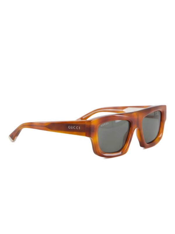 Gucci Eyewear Zonnebril met gegraveerd logo - Bruin
